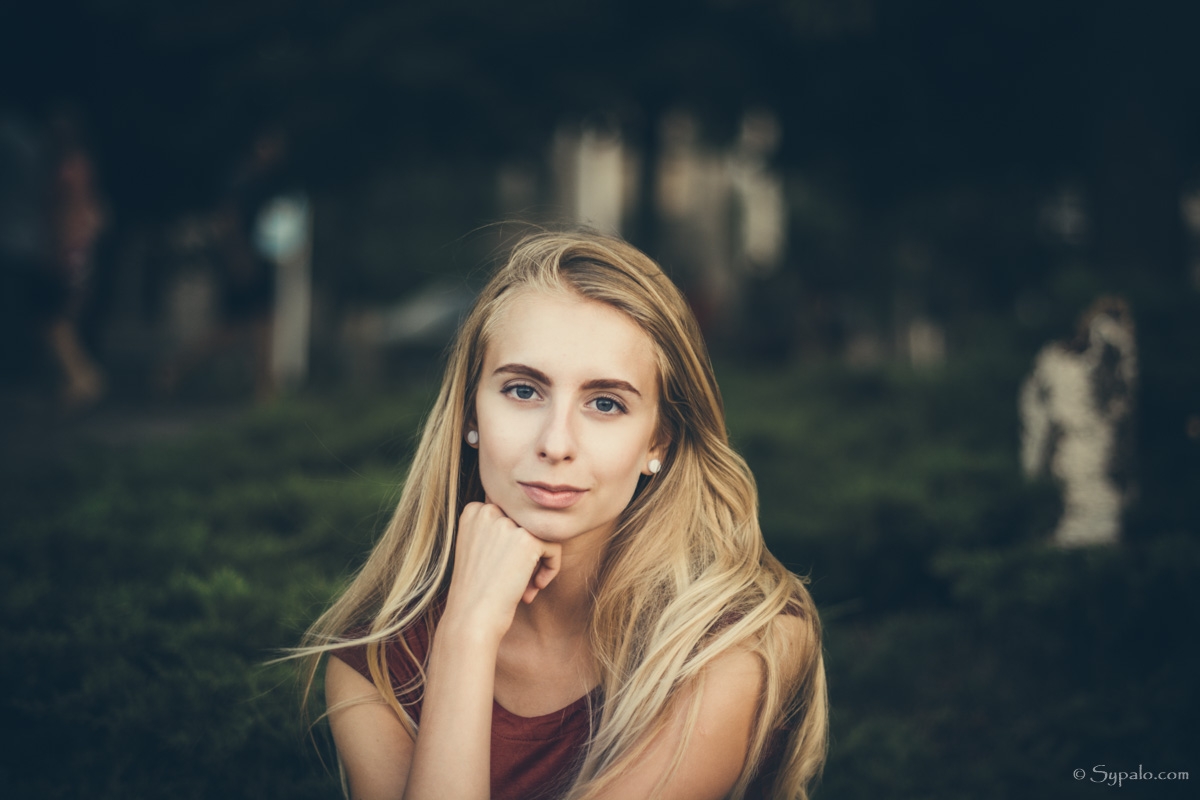 A portrait of a young beautiful blonde leaning on her arm